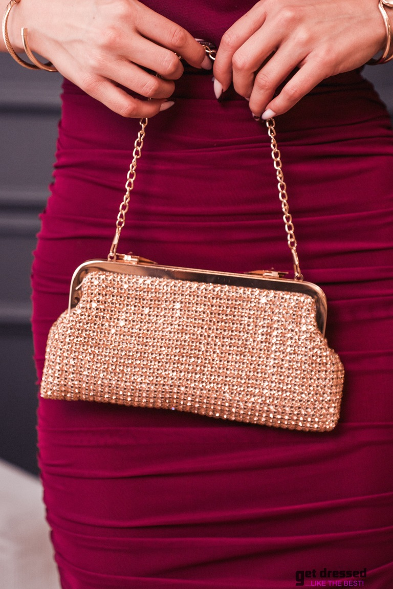 Kuldne kivikestega clutch